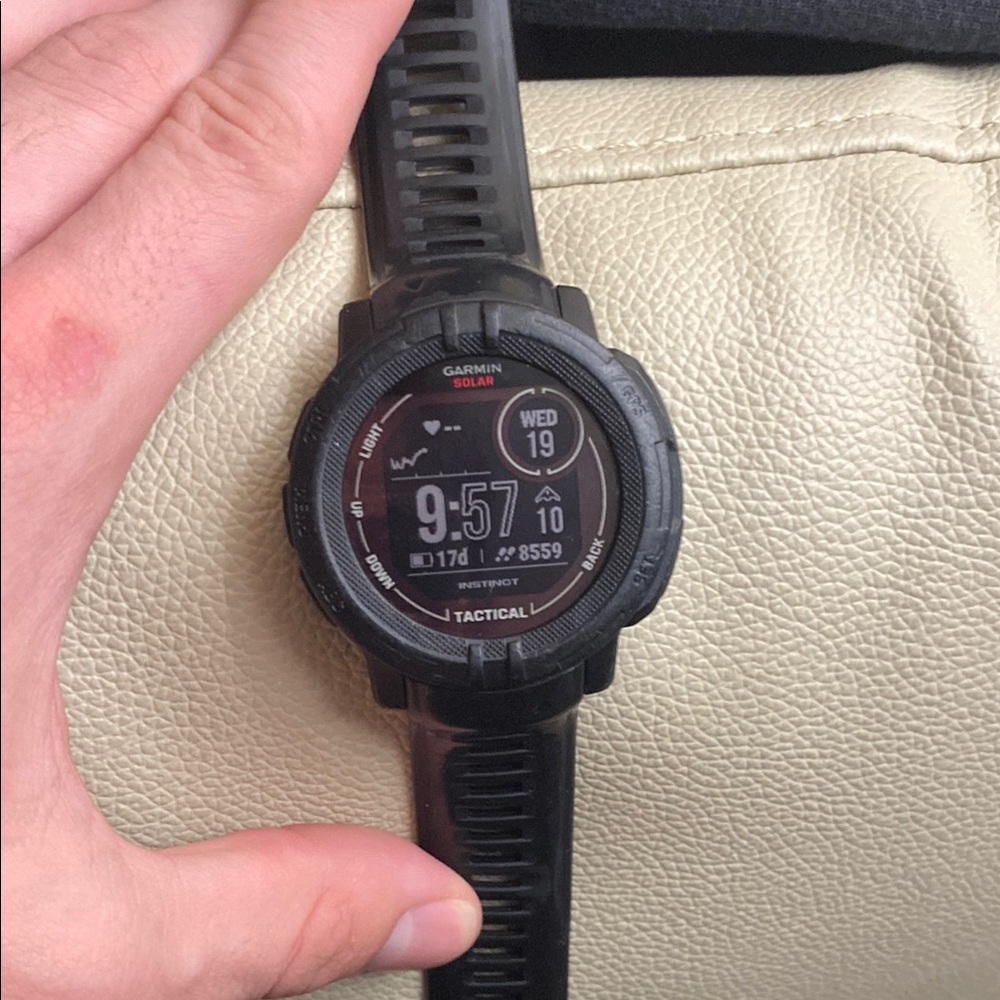 Garmin Black Smartwatch with Round Face and Digital Display